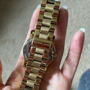 Michael Kors gold colored stainless steel watch. 8 inches around inside